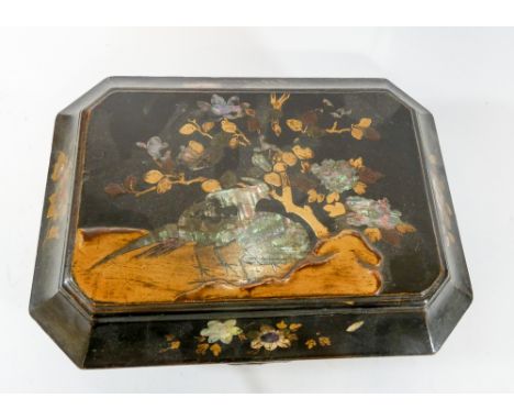 A mother of pearl inlaid black lacquered trinket box 