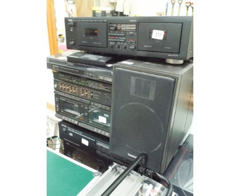 A Yamaha cassette deck, a Technics tape deck and record deck, a Rotel compact disc player, a Yamaha amplifier and two Technic