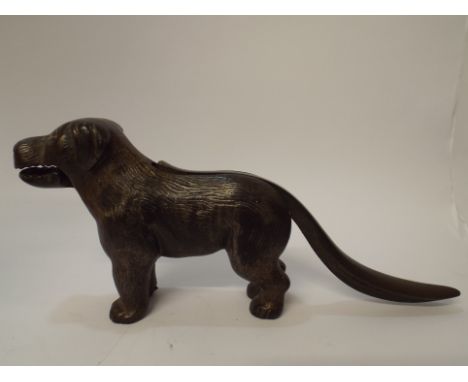 A pair of vintage cast iron nutcrackers modelled as a dog patent number printed into handle 