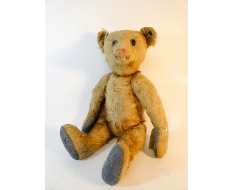 A vintage Steiff jointed Teddy bear in much loved condition, blue glass eyes and overall height 46cm 