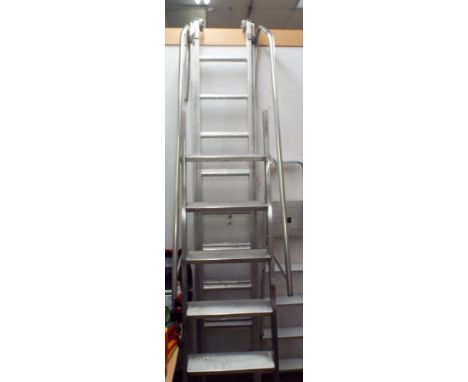 A heavy aluminium swimming pool ladder with six steps and handles 