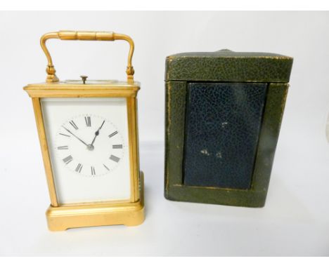 Henri Jacot repeater carriage clock, in gilt brass case with folding handle, 18 cms tall with handle up, with leather travell
