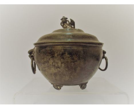 A Chinese pewter twin handled jar and cover with Dog of Fo finial and character marks to the base height 15cms 