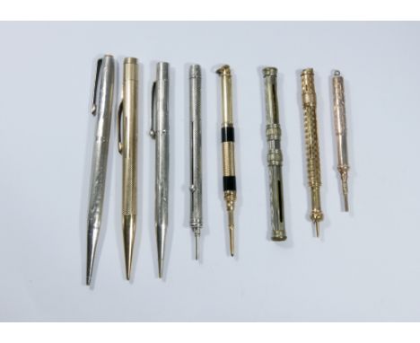 A collection of six early 20th century propelling pencils including a telescopic gold decorated example, an engine turned Sam