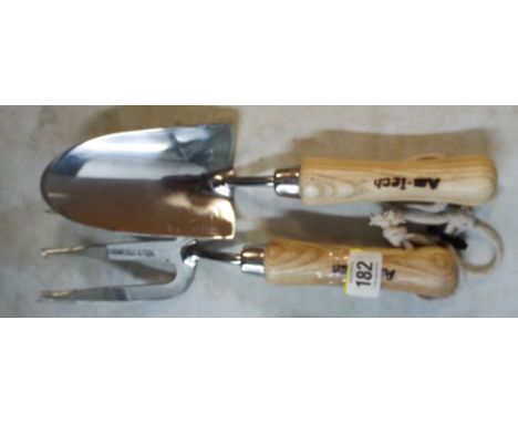 A stainless steel garden trowel and fork 
