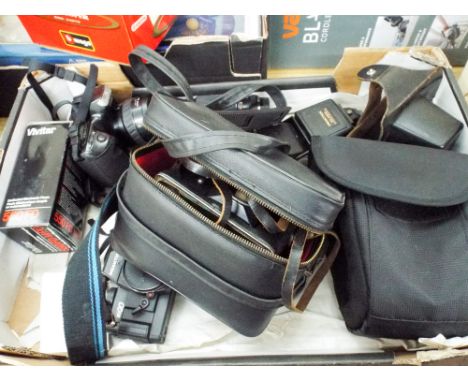 A box of camera's, camera accessories, lenses etc 