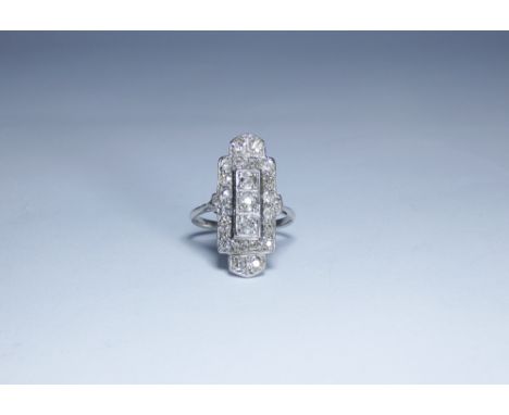 An Art Deco diamond panel ring, the large geometric panel set with old cut diamonds on an 18ct white gold shank, ring size 'K