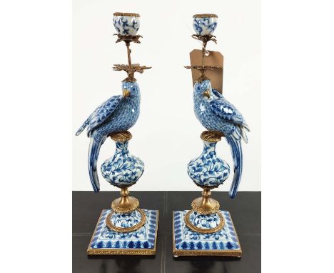 CANDELABRA, a pair, 48cm H, in the form of birds, blue and white ceramic, gilt mounts. (2) 
