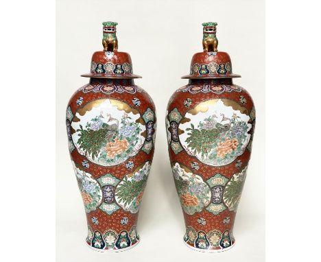 TEMPLE JARS, a pair, very large Chinese ceramic vases with covers, hand decorated polychrome panels depicting peacocks amidst