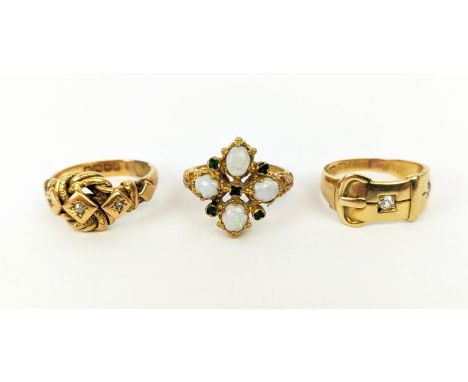 THREE VARIOUS DRESS RINGS, comprising an 18ct gold three stone diamond ring, scroll design setting with cushion set stones, r