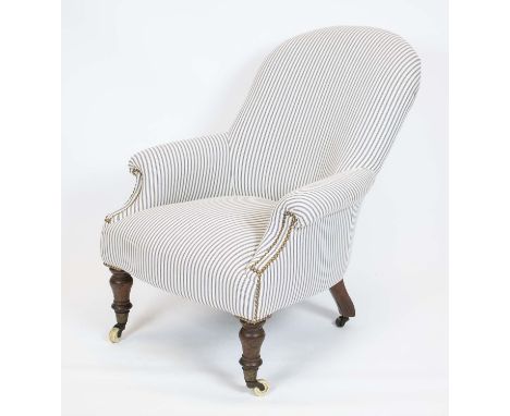 ARMCHAIR, 87cm H x 69cm, Victorian in ticking upholstery on ceramic front and steel rear castors. 