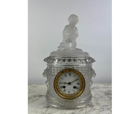 BACCARAT MANTLE CLOCK, late 19th century etched and frosted glass, with putto seated figural top, lion mask sides and white e