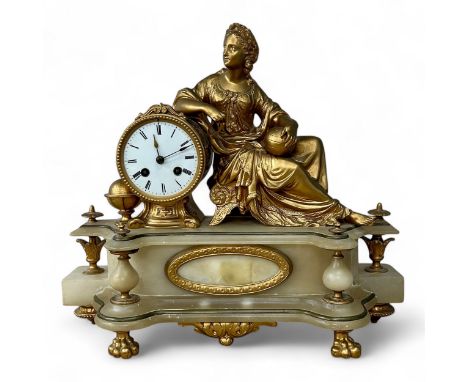 A late 19thC Neoclassical style alabaster and gilt metal clock, with a reclining lady holding calipers and a globe, with drum