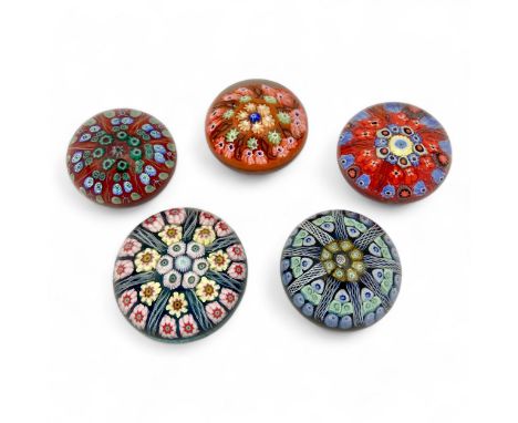 Five large Strathearn P.7 millefiori dome paperweights, with orange, red, dark blue and black grounds, one with original Stra