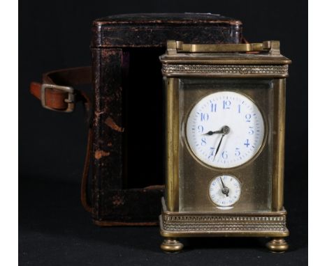 Early 20th century French brass carriage clock, the enamel Arabic dials with blue numerals, striking on a bell on the base, i