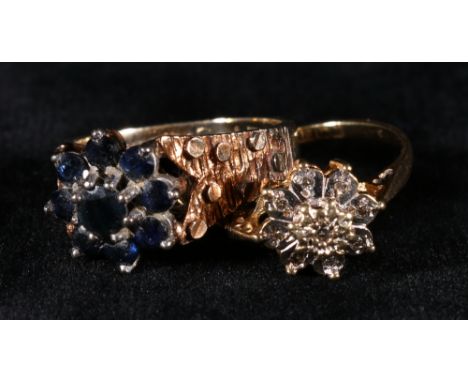 9ct gold sapphire cluster ring with textured shoulders, size L/M 4.3g and a 18ct gold diamond point cluster ring, size Q/R. 2