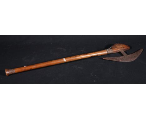 African axe with steel blade, the shaped handle with carved ringed decoration, 66cm   CONDITION REPORT:  Natural grain split 