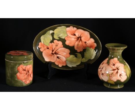 Moorcroft oval orchid pattern tray, 23cm also a similiar vase and a toilet jar, 10cm (3)   CONDITION REPORT:  Toilet jar cove