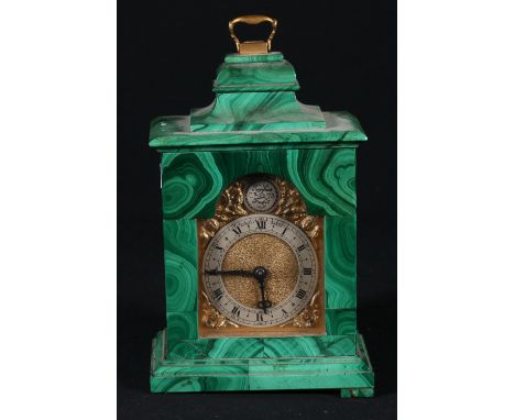 Asprey of London malachite carriage clock, the arched brass dial with Roman silvered chapter, some losses, 17cm.   CONDITION 