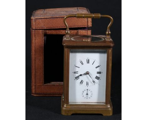 French brass carriage clock, the Roman enamel dial with alarm dial, the movement striking a bell, 16cm, in leather case.