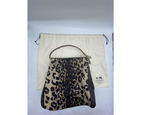 Coach Madison Ocelot Leopard Animal Print Phoebe Shoulder Bag. 
No further descriptions, photographs, or condition reports ar