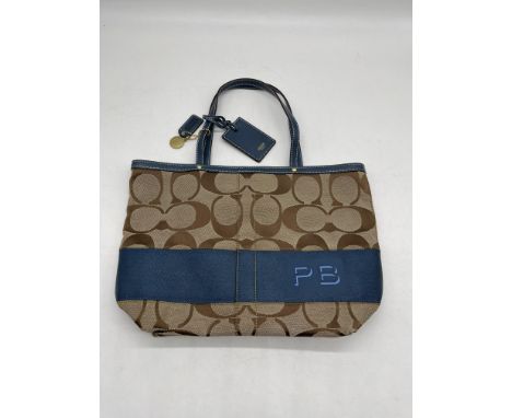 Coach Brown Signature and Blue Canvas Tote Bag. 
No further descriptions, photographs, or condition reports are available for