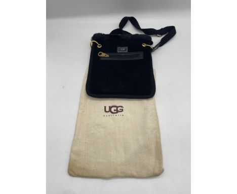 UGG Australia Black Suede Shearling Crossbody Bag. 
No further descriptions, photographs, or condition reports are available 