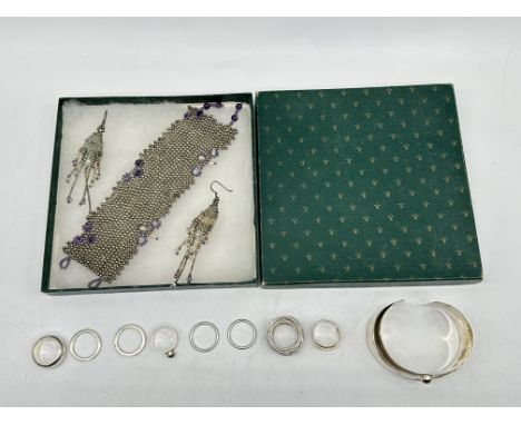 Silver Beads Bracelet and Earrings, along with Silver Rings and Silver Bangle. 
Total Silver Weight 131gr. 