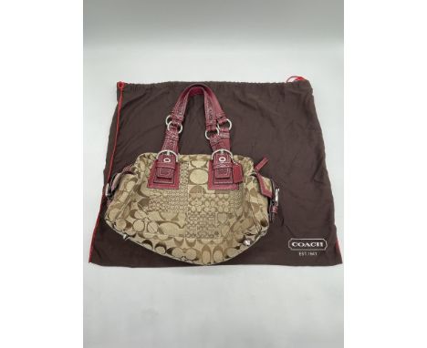 Coach Prairie Satchel Cloth Handbag. 
No further descriptions, photographs, or condition reports are available for this item.