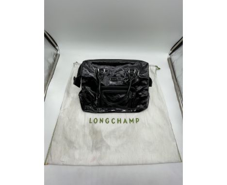 Longchamp Legende Verni Frame Black Leather Patent Tote Bag. 
No further descriptions, photographs, or condition reports are 
