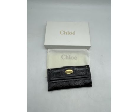 Chloe Black Leather Long Wallet Purse. 
No further descriptions, photographs, or condition reports are available for this ite