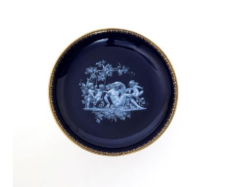A good Meissen pâte-sur-pâte cabinet plate, late 19th century, finely decorated with a bacchanalian scene emblematic of Autum