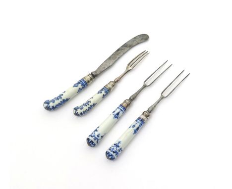 A dessert knife and fork with St Cloud porcelain handles, c.1720-40, with pistol hafts painted in blue with lambrequin and fo