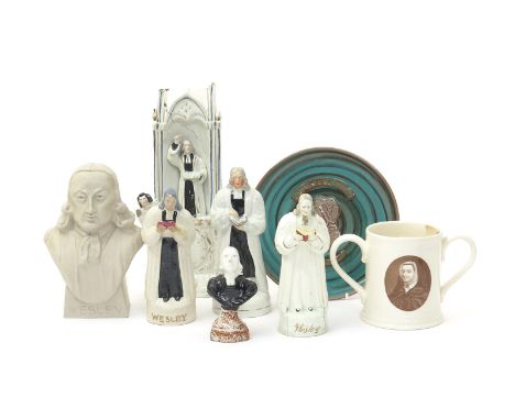 Four Staffordshire figures of John Wesley, 2nd half 19th century, one in a pulpit above a clock dial, three standing and hold