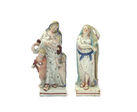 Two Staffordshire figures of Hope and Charity, c.1800-10, both modelled as Classical maidens, the former standing beside a ta