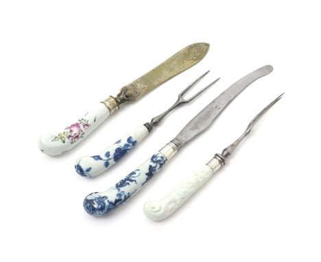 Two Worcester knife handles and two forks, c.1758-65, a two-pronged fork with a white-glazed pistol haft moulded with a strun