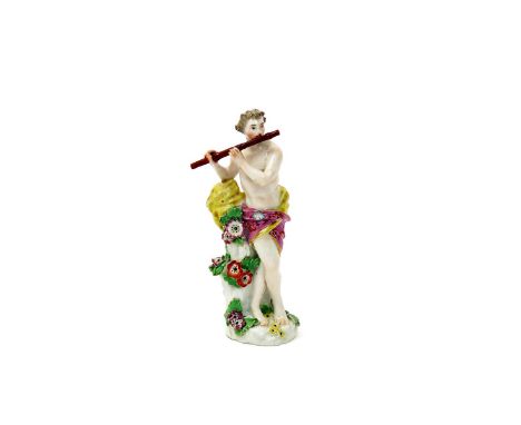 A small Chelsea figure of a musician, c.1760-65, naked except for a flowered robe wrapped around his waist, playing the flute