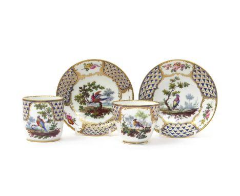 Two Sèvres cups and saucers, date codes for 1760 to one, painted by François Aloncle with panels of birds and small flower sp