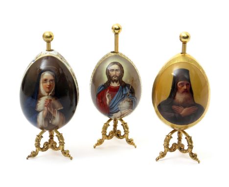 Three Russian porcelain Easter eggs, 19th/20th century, one Imperial Factory St Petersburg and painted with a portrait of Sai