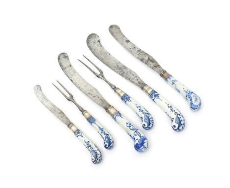 Four Bow blue and white knife handles and two fork handles, c.1750-58, of pistol shape, variously decorated with lambrequin d