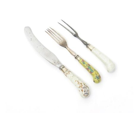 Three Bow cutlery handles, c.1755-58, an armorial knife with a pistol haft moulded and painted in polychrome enamels with a m