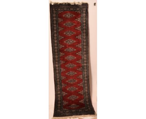 A red carpet runner with grey decorative border. L=245, W=79cm