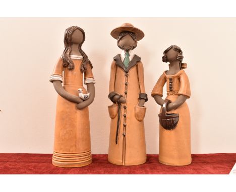 A set of three Elbogen handmade ceramic figures. H=43, W=12, D=12cm