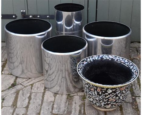 A collection of metal garden pots and a ceramic decorative pots. 