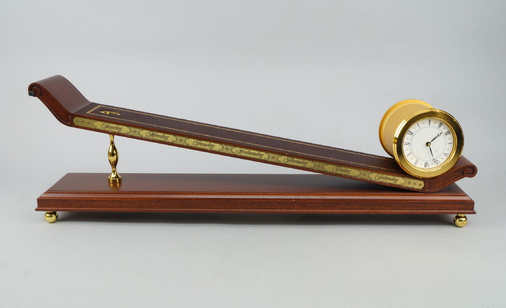 A Franklin Mint rolling plain clock, designed by the Musee