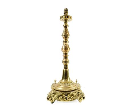 A Brass Gas Table Lamp, late 19th century, of knopped baluster form, on a circular base with four cast feet, 54cm high, conve