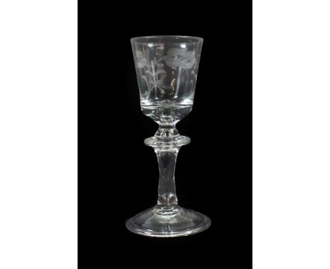 A Hessen Wine Glass, mid 18th century, the rounded bucket bowl engraved with foliage on a knopped stem with air tear and fold