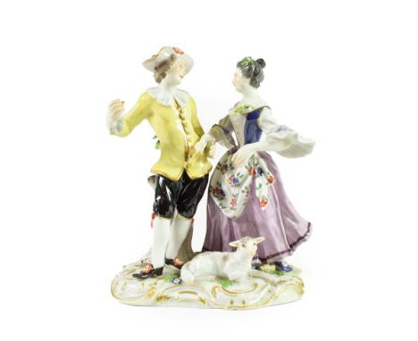 A Meissen Porcelain Figure Group, late 19th/20th century, as an 18th century shepherd and shepherdess dancing, a sheep at the