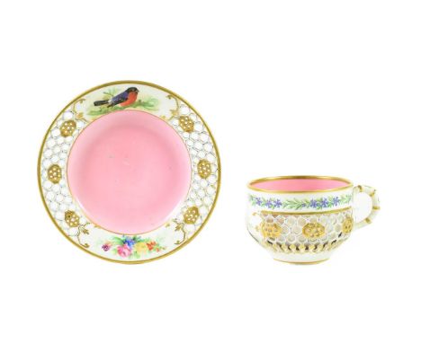 A Royal Worcester Porcelain Reticulated Cabinet Cup and Saucer, circa 1870, painted with finches and flowersprays within gilt