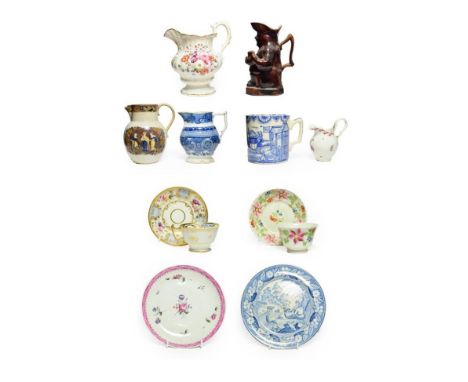 An English Porcelain Teacup and Saucer, circa 1810, painted with flowersprays within blue panel borders; A New Hall Type Crea